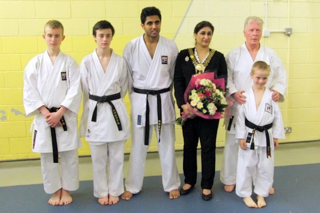 Bradford Shotokan Students line up to accept a karate award from the Lady Mayoress of Bradford